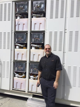 Redflow executive chairman Simon Hackett with a Large Scale Battery (LSB) unit